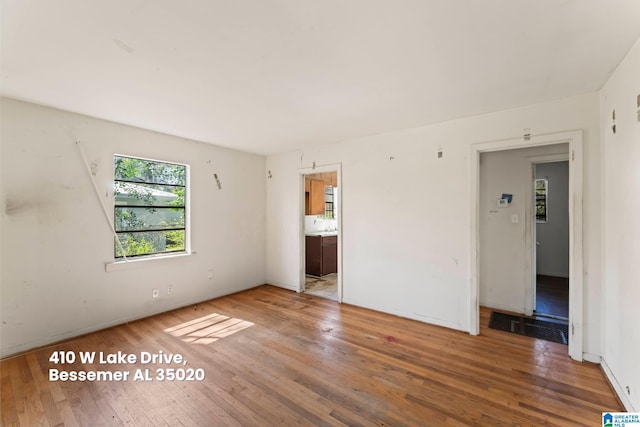 spare room with visible vents and hardwood / wood-style floors