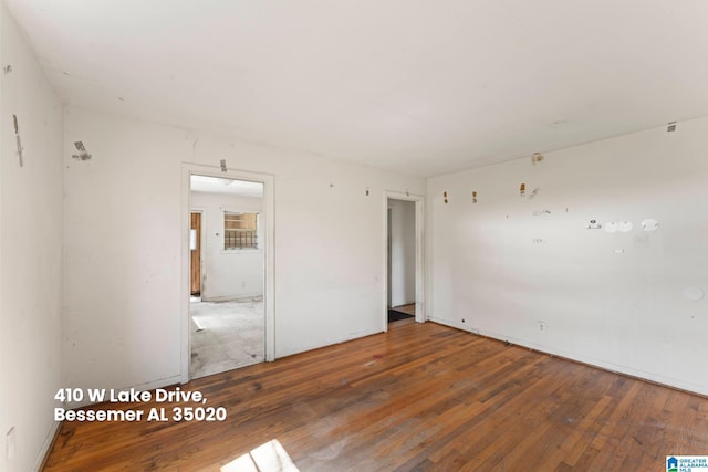 empty room featuring wood-type flooring