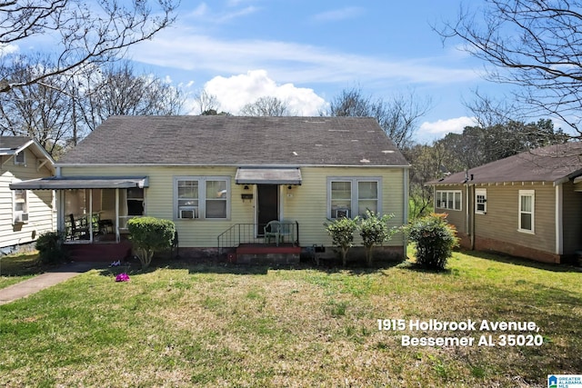 bungalow-style house with a front lawn