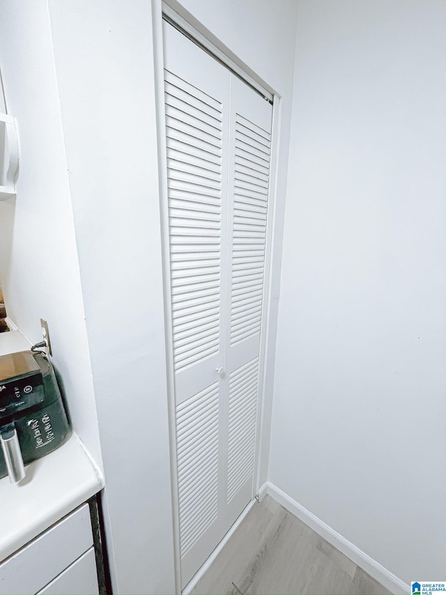 details featuring baseboards and wood finished floors
