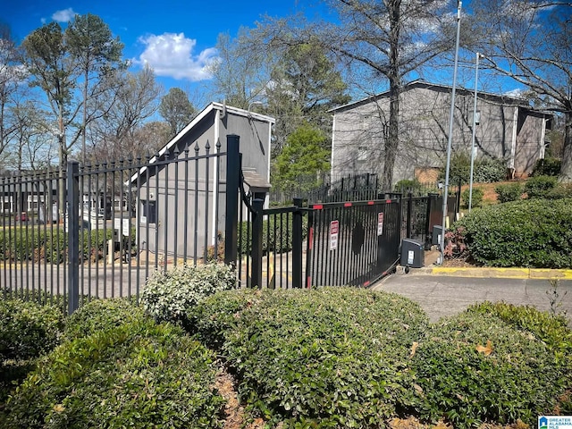view of gate featuring fence