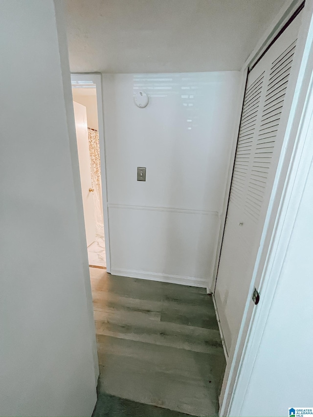 hallway with wood finished floors