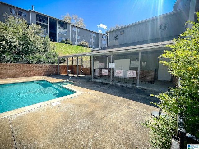community pool featuring a patio area