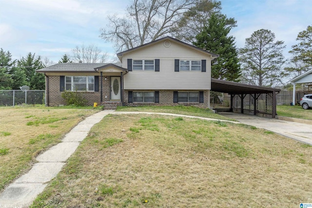 5400 Etta Dr, Mount Olive, AL 35117 - tri-level home featuring concrete driveway, fence, a front lawn, brick siding, and a carport