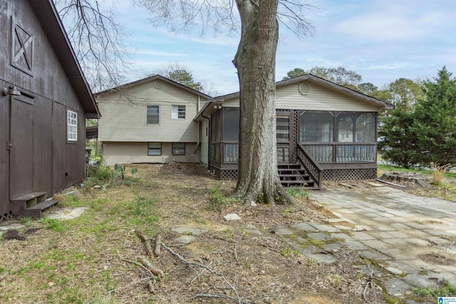 5400 Etta Dr, Mount Olive, AL 35117 - rear view of property featuring a sunroom