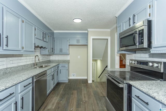 5400 Etta Dr, Mount Olive, AL 35117 - kitchen with dark wood-type flooring, ornamental molding, a sink, and appliances with stainless steel finishes