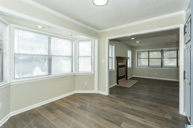 5400 Etta Dr, Mount Olive, AL 35117 - unfurnished living room featuring dark wood-style floors, baseboards, a textured ceiling, and crown molding