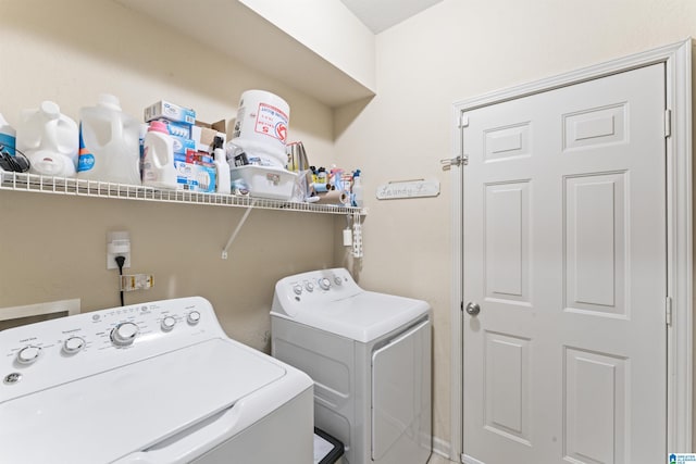 washroom featuring washer and dryer and laundry area