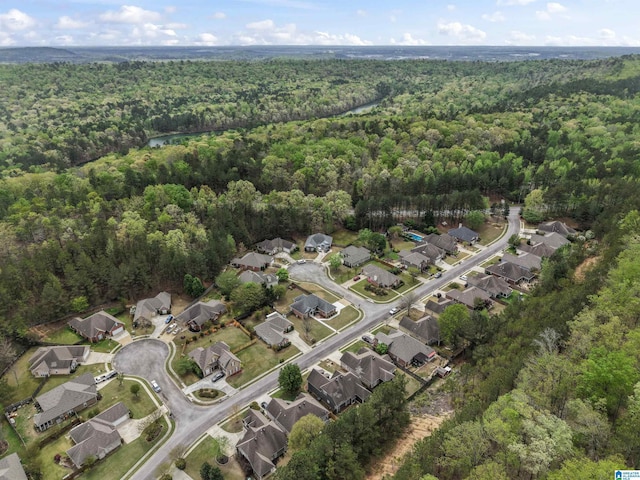 aerial view with a wooded view and a residential view