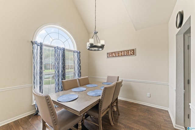 dining room with wood-type flooring, baseboards, a notable chandelier, and vaulted ceiling