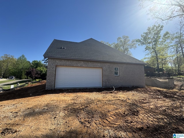 104 Linden Ln, Birmingham, AL 35242 - view of home's exterior with an outbuilding, a garage, and brick siding