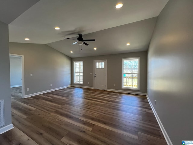 unfurnished living room with lofted ceiling, a ceiling fan, recessed lighting, and dark wood-style flooring