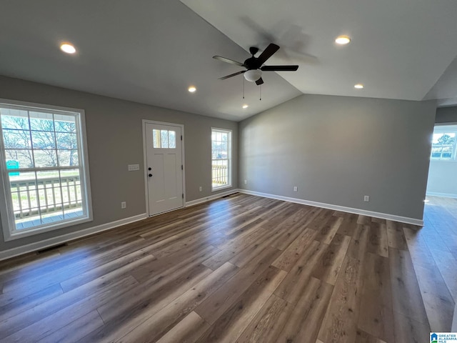 unfurnished living room featuring vaulted ceiling, a ceiling fan, visible vents, recessed lighting, and dark wood-style flooring