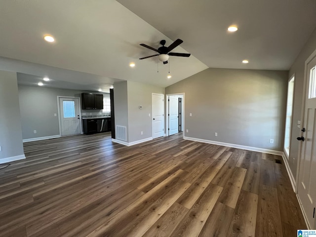 unfurnished living room with visible vents, baseboards, ceiling fan, dark wood finished floors, and lofted ceiling
