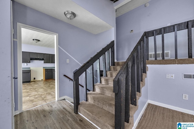 2610 Gaylon St, Birmingham, AL 35235 - stairs featuring baseboards