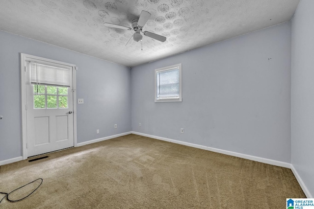 2610 Gaylon St, Birmingham, AL 35235 - carpeted spare room with plenty of natural light, a ceiling fan, a textured ceiling, and baseboards