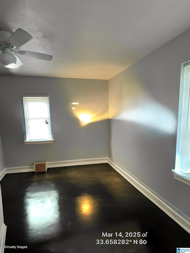 2610 Gaylon St, Birmingham, AL 35235 - spare room featuring baseboards, finished concrete floors, and healthy amount of natural light