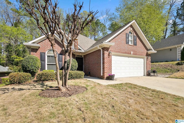 view of front of property with a front lawn, roof with shingles, brick siding, and concrete driveway