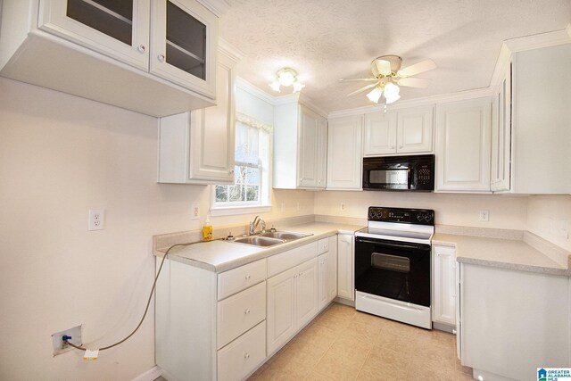 kitchen featuring a sink, white cabinets, black microwave, and electric range oven