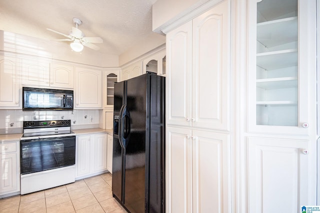 kitchen featuring light countertops, ceiling fan, glass insert cabinets, black appliances, and light tile patterned floors