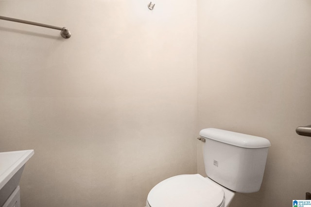 bathroom featuring toilet and vanity