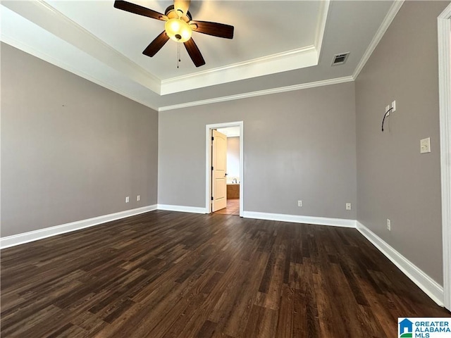 11433 Belle Meade Way, Northport, AL 35475 - spare room featuring baseboards, visible vents, dark wood-type flooring, and a raised ceiling