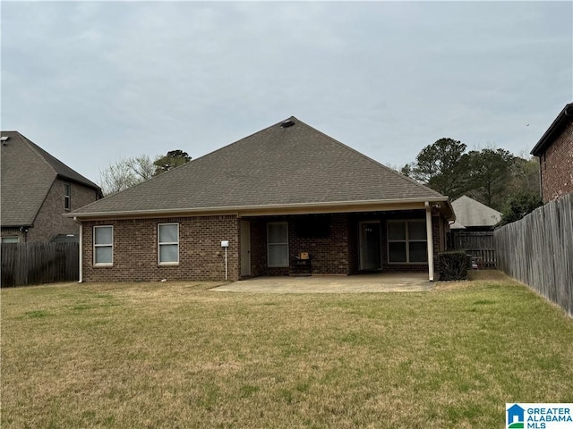 11433 Belle Meade Way, Northport, AL 35475 - back of house featuring a lawn, brick siding, a fenced backyard, and a patio