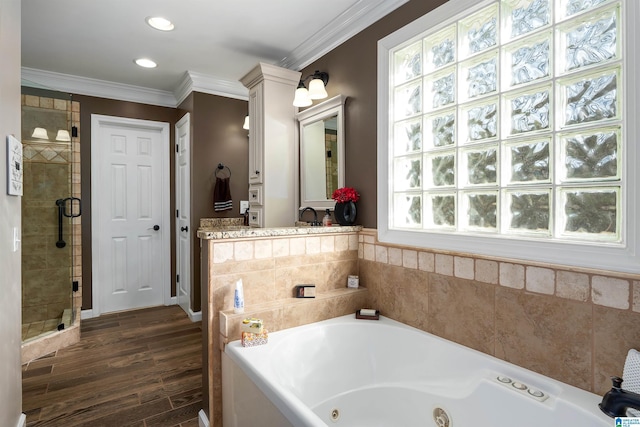 bathroom featuring crown molding, a whirlpool tub, recessed lighting, a shower stall, and wood finished floors