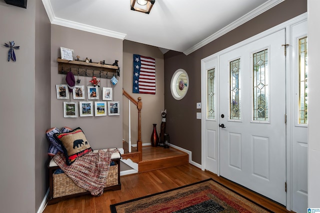 entrance foyer featuring a wealth of natural light, baseboards, crown molding, and wood finished floors
