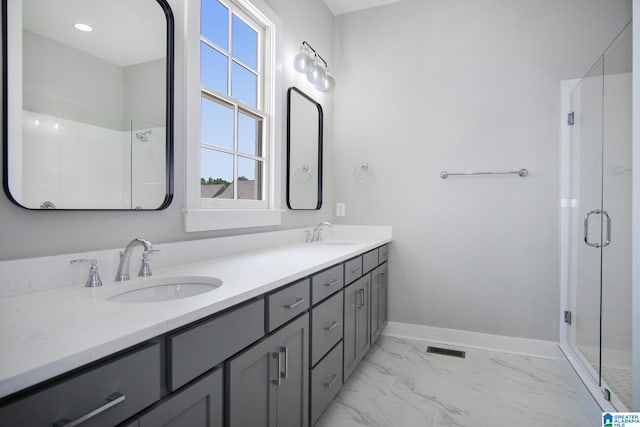 516 Preserve Pkwy, Hoover, AL 35226 - full bath featuring baseboards, marble finish floor, a sink, and a stall shower