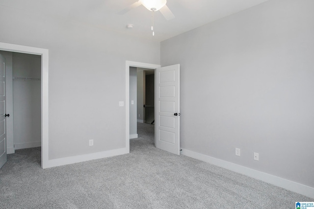 516 Preserve Pkwy, Hoover, AL 35226 - unfurnished bedroom featuring baseboards, carpet floors, a walk in closet, and a ceiling fan