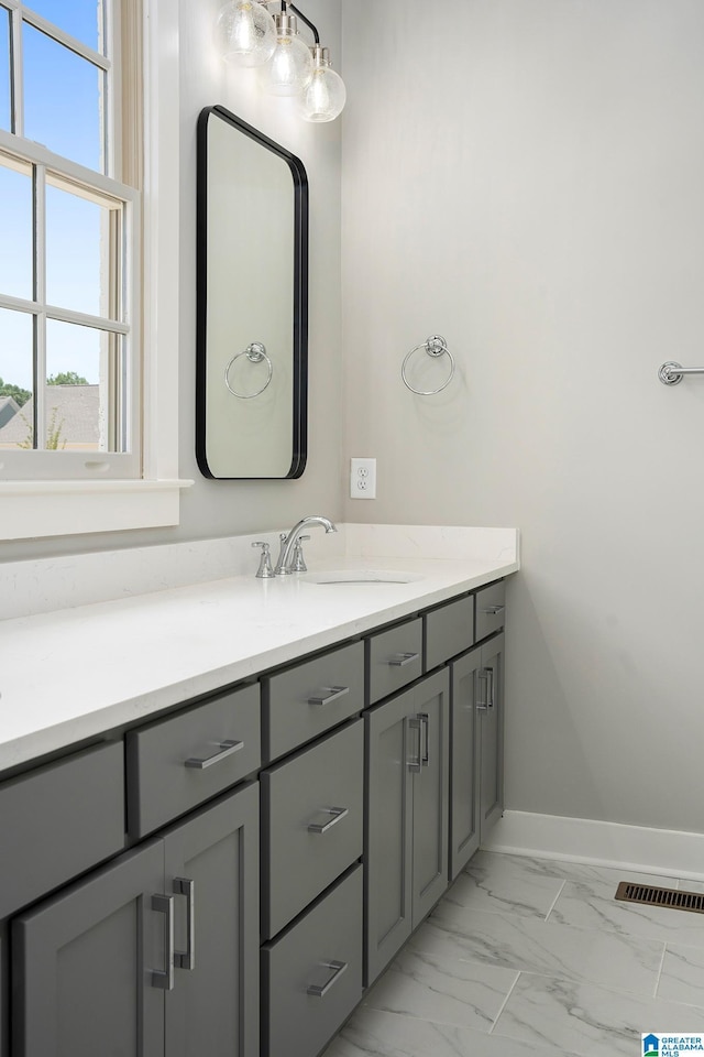516 Preserve Pkwy, Hoover, AL 35226 - bathroom featuring baseboards, marble finish floor, visible vents, and vanity