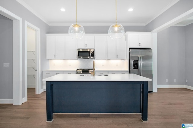 516 Preserve Pkwy, Hoover, AL 35226 - kitchen with stainless steel appliances, decorative backsplash, a sink, an island with sink, and white cabinets