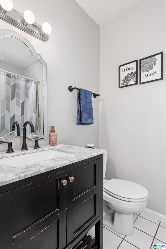 full bathroom featuring a shower with curtain, toilet, tile patterned flooring, and vanity