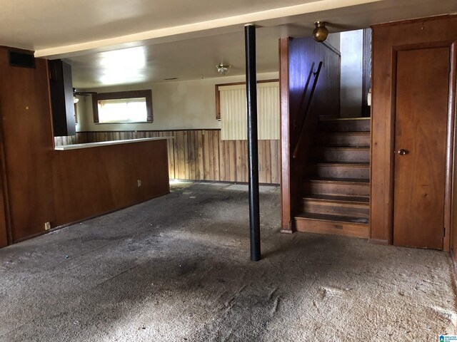 925 Ann St, Birmingham, AL 35228 - below grade area with a wainscoted wall, wooden walls, and stairs