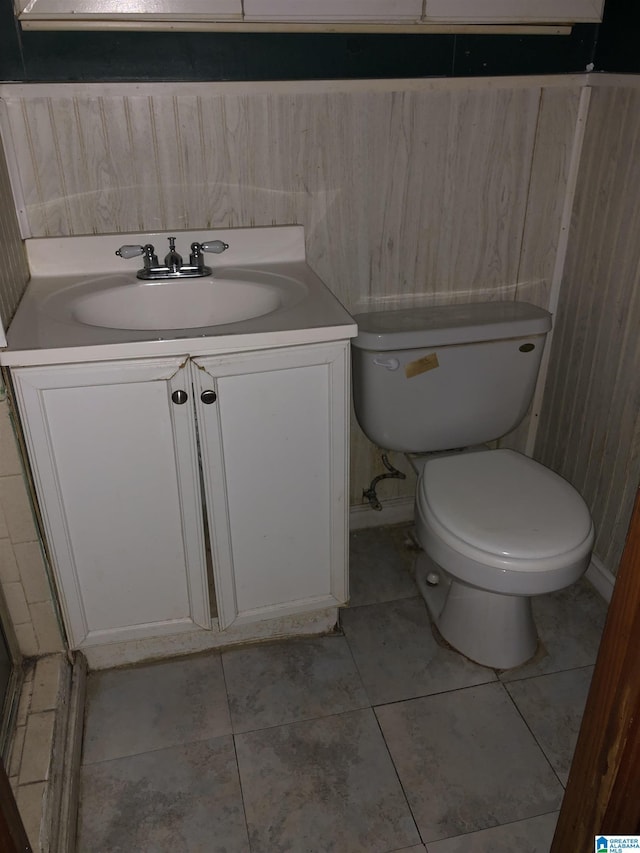 925 Ann St, Birmingham, AL 35228 - bathroom featuring toilet, tile patterned flooring, and vanity