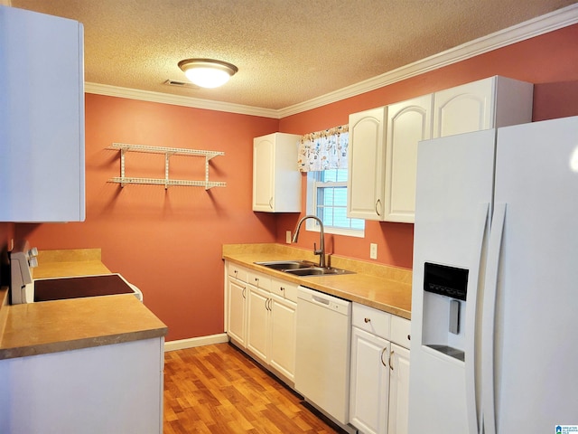 600 Mayfair Ln, Cullman, AL 35057 - kitchen with white appliances, ornamental molding, white cabinetry, a sink, and light wood-style floors