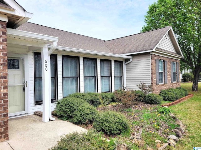 600 Mayfair Ln, Cullman, AL 35057 - view of side of property with brick siding and roof with shingles