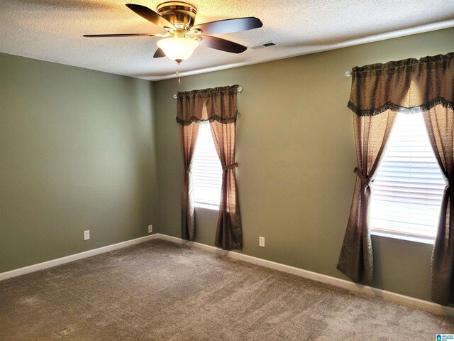 600 Mayfair Ln, Cullman, AL 35057 - empty room with a textured ceiling, baseboards, visible vents, ceiling fan, and carpet
