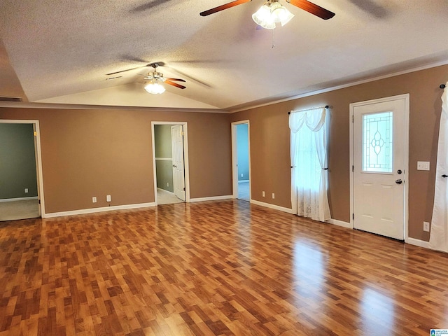 600 Mayfair Ln, Cullman, AL 35057 - interior space with a textured ceiling, baseboards, ceiling fan, wood finished floors, and lofted ceiling