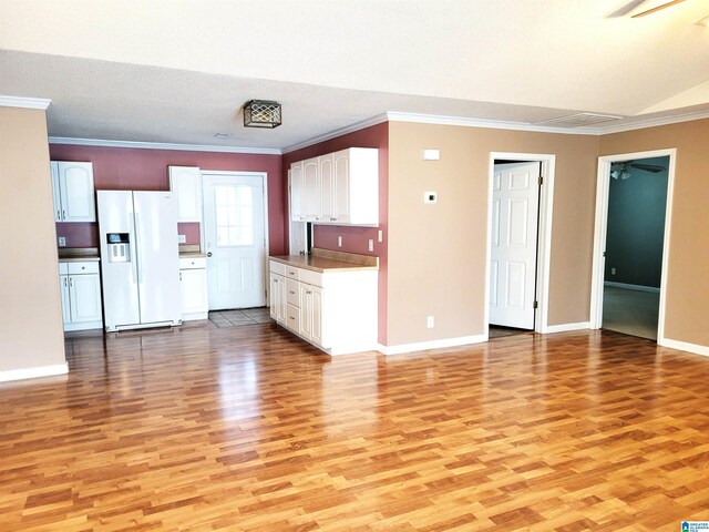 600 Mayfair Ln, Cullman, AL 35057 - kitchen featuring white cabinets, white fridge with ice dispenser, a ceiling fan, and light wood finished floors