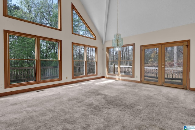 unfurnished sunroom with visible vents and an inviting chandelier