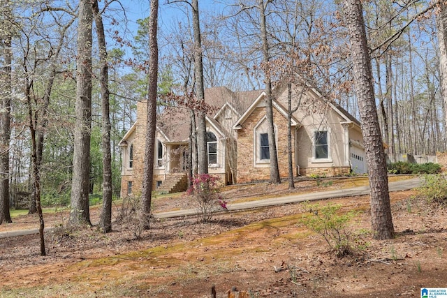 view of front of house featuring stucco siding and a garage