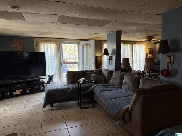 1520 Tropical Cir, Alabaster, AL 35007 - living area featuring light tile patterned flooring, ceiling fan, and a drop ceiling