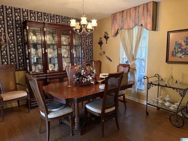 1520 Tropical Cir, Alabaster, AL 35007 - dining space featuring a textured ceiling, wood finished floors, baseboards, and a chandelier