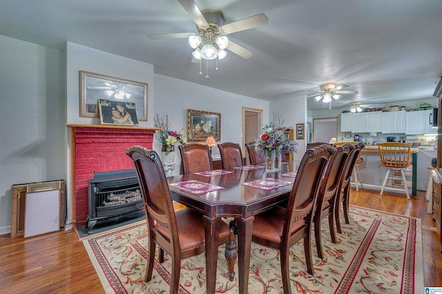 dining room featuring ceiling fan and light wood-type flooring