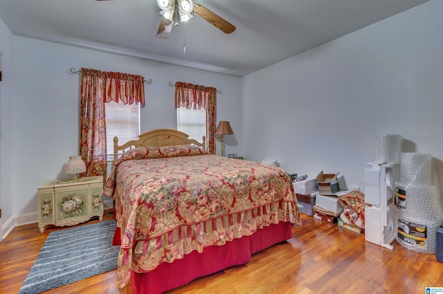 bedroom with wood finished floors and ceiling fan