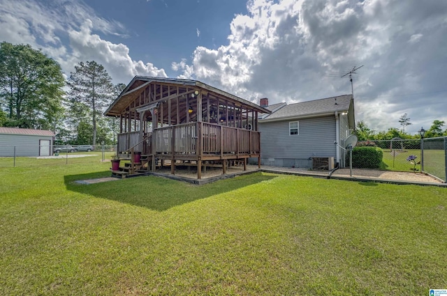 rear view of property featuring crawl space, a lawn, central AC, a deck, and fence