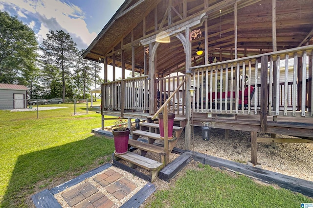 wooden terrace with a lawn