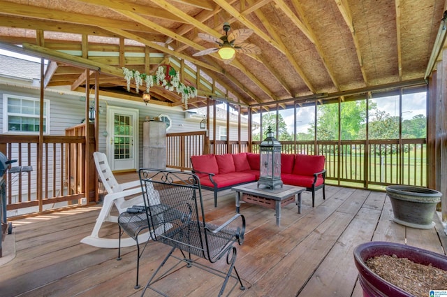 sunroom with an outdoor living space and ceiling fan